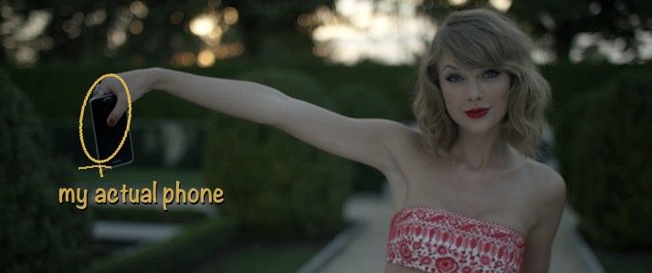 Taylor Swift in the Blank Space music video holding out a phone, annotated with a note that reads: my actual phone.