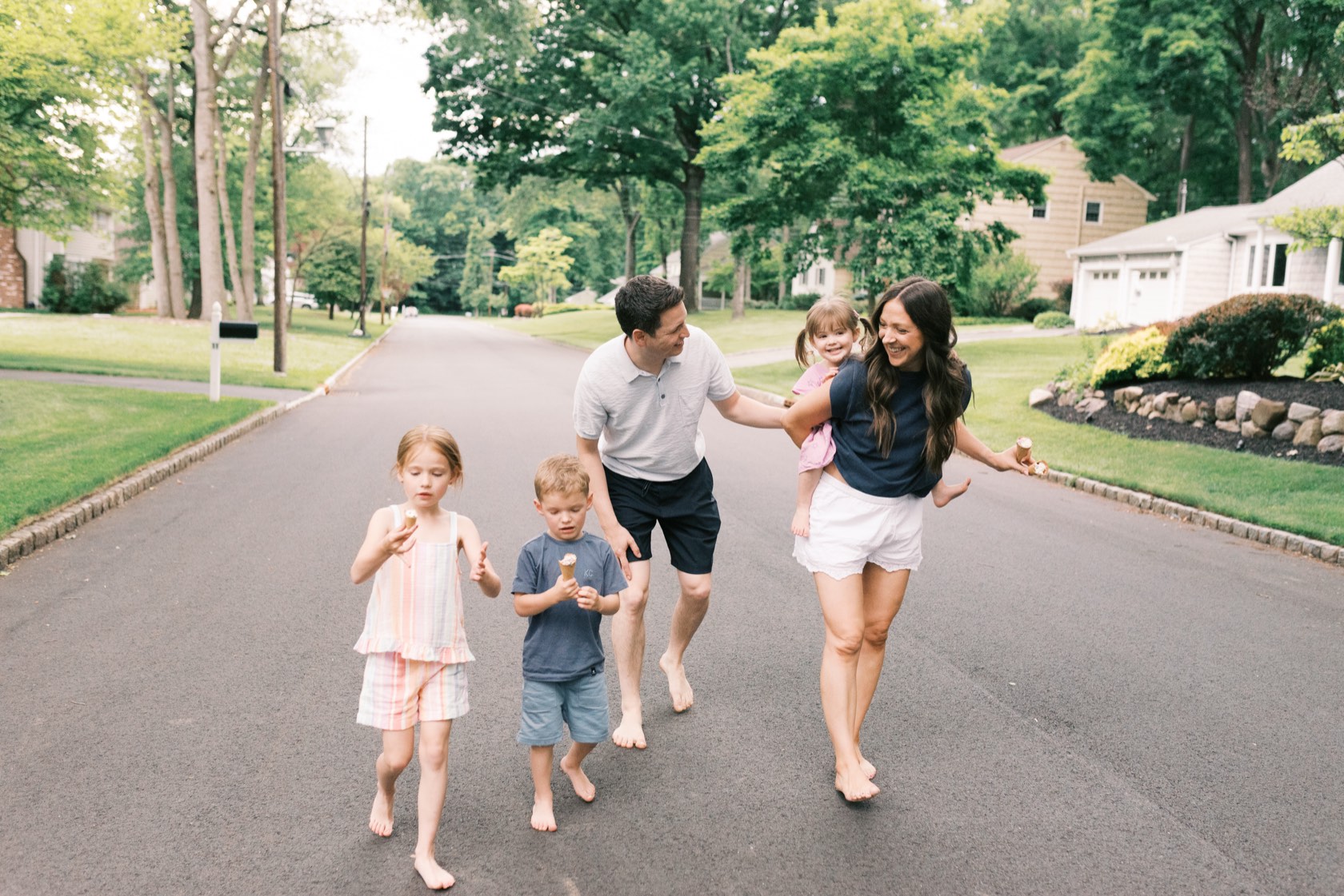 Justin, Steph and their kids walking down their street in Morris County, New Jersey