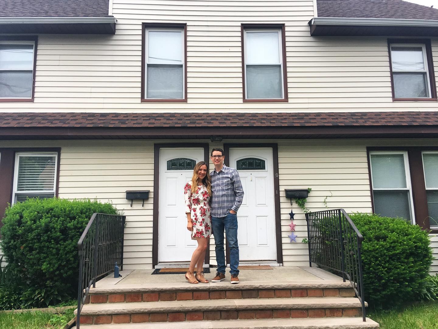 Justin and Steph in front of their first duplex, 2017