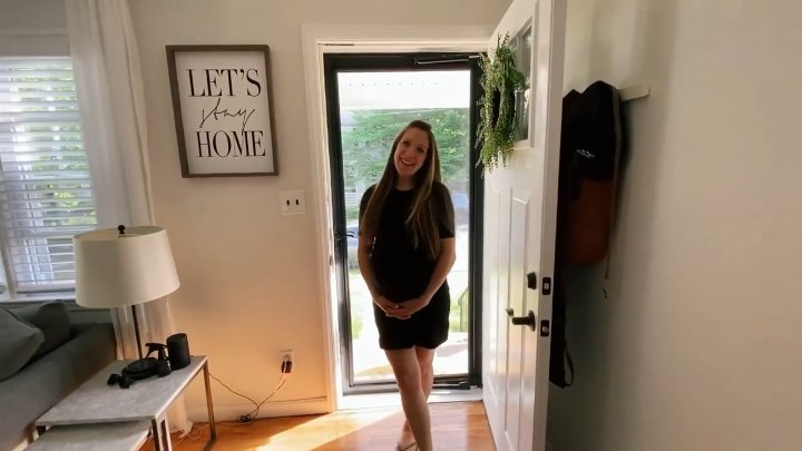 Steph at the door of the finished fixer-upper