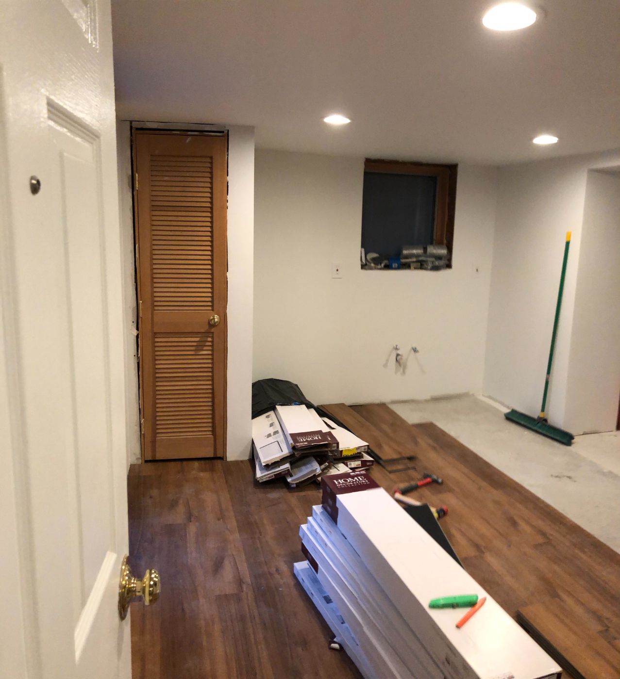 Flooring going down, boxes still stacked.