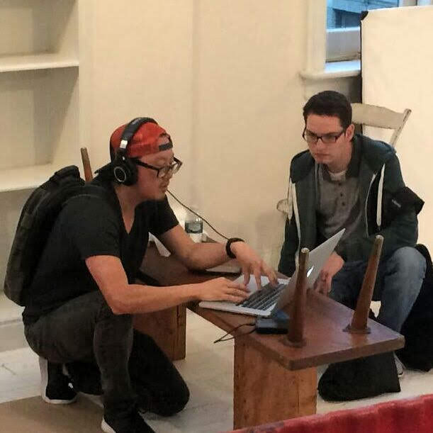 Justin reviewing edits at a laptop with director Joseph Kahn.