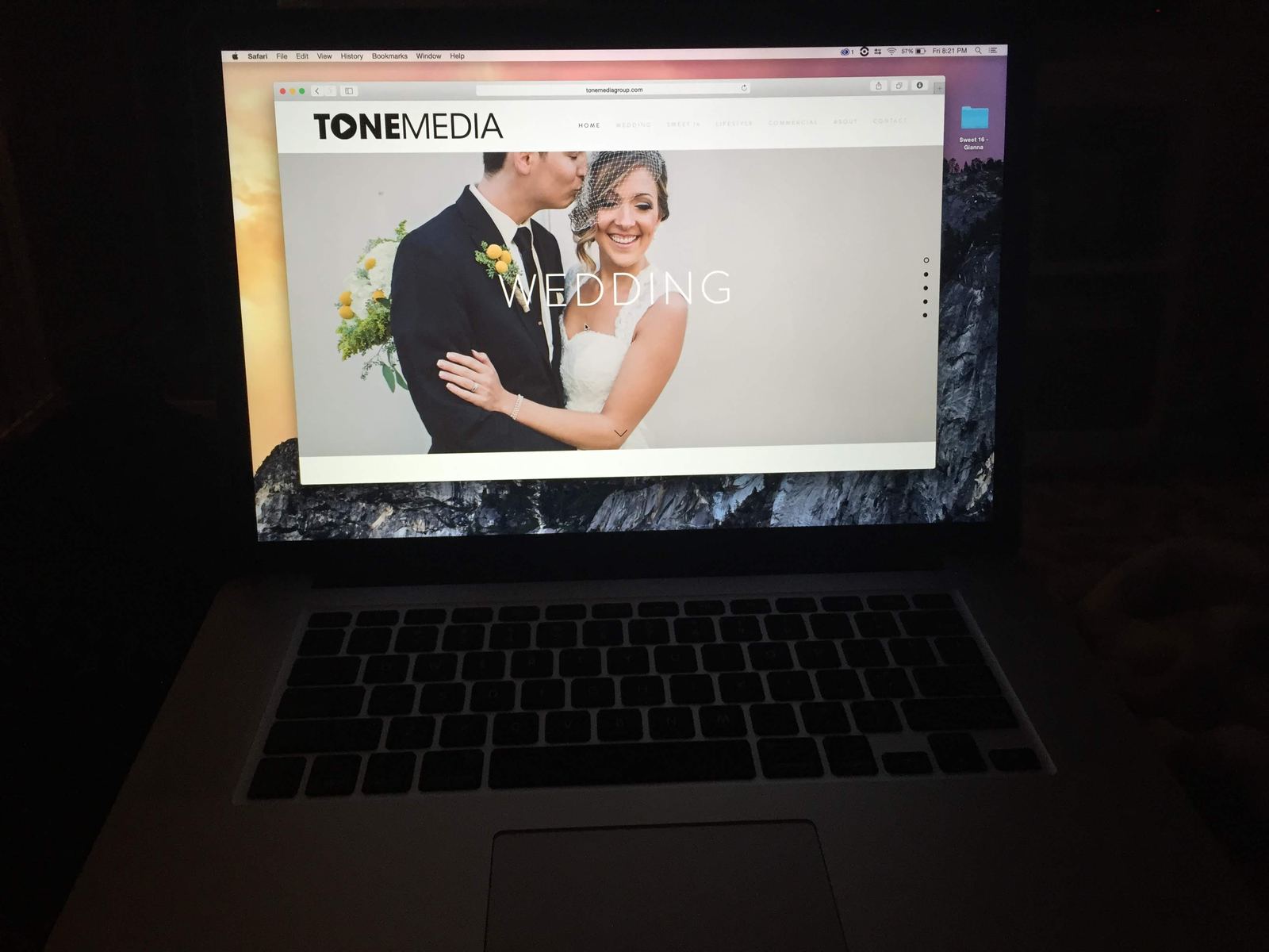 A laptop showing the first Tonemedia website, open to the wedding page.