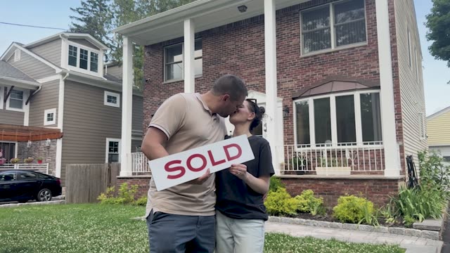 Couple outside their new home in Morris County, NJ — Tonehomes real estate